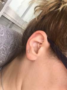 Rebecca Atcherson has worn hearing aids for 32 years and Oticon agil pro rite aids (pictured) for four years. 