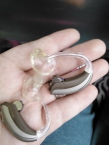 Alexis McKee shows off her new 'ears': Widex hearing aids. 